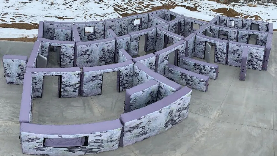 Inflatable and portable walls configured to resemble the interior of a house or building for shooting practice.